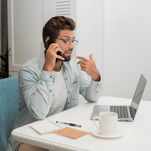Mentor guiding a new broker through loan documentation